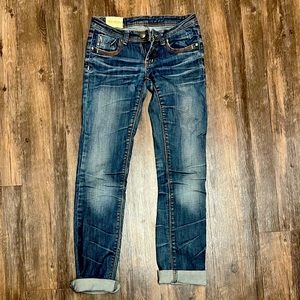 Machine brand low rise bootcut jeans with orange stitching. Size 27